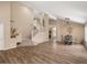 Open-concept living space with hardwood floors, a staircase, and dining area at 7924 Mcdowell Dr, Las Vegas, NV 89129