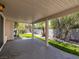 Covered patio offers an outdoor living space with views of the landscaped backyard and block wall for privacy at 7924 Mcdowell Dr, Las Vegas, NV 89129