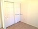 Cozy bedroom features tiled floors and a convenient double-door closet at 8417 Running Deer Ave # 101, Las Vegas, NV 89145