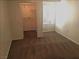 Neutral bedroom offers a bright window, plush carpet, and walk-in closet at 8417 Running Deer Ave # 101, Las Vegas, NV 89145
