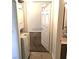 Convenient laundry area with stackable washer and dryer near bathroom at 8417 Running Deer Ave # 101, Las Vegas, NV 89145