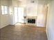 Living room with fireplace, neutral walls, and tile flooring at 8417 Running Deer Ave # 101, Las Vegas, NV 89145