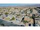Expansive aerial view of a residential neighborhood showcasing the community's layout and surrounding landscape with mountain backdrop at 849 Brahma Ln, Henderson, NV 89002