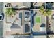 Aerial view of house featuring solar panels, gravel landscape, artifical grass and a storage shed at 849 Brahma Ln, Henderson, NV 89002