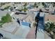 Aerial view of a single Gathering home featuring blue garage door and solar panels at 849 Brahma Ln, Henderson, NV 89002