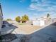 Spacious backyard with gravel, concrete patio, artifical grass and a storage shed with block wall at 849 Brahma Ln, Henderson, NV 89002