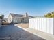 Backyard featuring gravel landscape, artifical grass and a storage shed with the house visible in the background at 849 Brahma Ln, Henderson, NV 89002