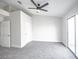 Bright bedroom features a ceiling fan, neutral color palette, and a sliding glass door at 849 Brahma Ln, Henderson, NV 89002