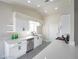 Bright eat-in kitchen featuring white cabinets, stainless steel appliances, and sleek countertops at 849 Brahma Ln, Henderson, NV 89002