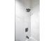 Modern bathroom shower featuring square rainfall shower head and gray fixtures with a tiled marble wall at 849 Brahma Ln, Henderson, NV 89002