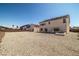 Large backyard showcasing desert landscaping and featuring a built-in hot tub at 8753 Mann St, Las Vegas, NV 89139