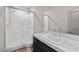 Modern bathroom featuring marble walk-in shower and sleek vanity with marble countertop at 8753 Mann St, Las Vegas, NV 89139