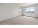 Bright bedroom with carpet, featuring a large window with a view at 8753 Mann St, Las Vegas, NV 89139