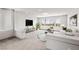 This bonus room is virtually staged with a sofa and TV at 8753 Mann St, Las Vegas, NV 89139