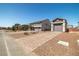 A collection of two-story homes with attached garages and paved driveways, all with desert landscaping at 8753 Mann St, Las Vegas, NV 89139