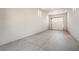 Spacious and well-lit three-car garage with smooth concrete flooring at 8753 Mann St, Las Vegas, NV 89139