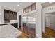 Modern kitchen area with a stainless steel refrigerator and ample storage at 8753 Mann St, Las Vegas, NV 89139