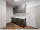 Convenient mudroom complete with ample cabinetry and granite countertop at 8753 Mann St, Las Vegas, NV 89139