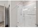Elegant glass shower with marble tiles, brushed silver hardware, and a built-in showerhead at 8753 Mann St, Las Vegas, NV 89139