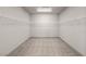 Unstaged walk-in closet with upper shelving and carpeted flooring at 8753 Mann St, Las Vegas, NV 89139