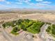 Expansive aerial view of the estate showcasing the beautiful landscaped grounds and surrounding desert landscape at 8808 Homestead Rd, Las Vegas, NV 89143