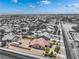Wide aerial shot of a home featuring a large, fenced yard with RV parking and a covered patio at 8808 Homestead Rd, Las Vegas, NV 89143