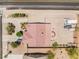 Aerial view of house featuring a wide driveway, desert landscaping, and outdoor seating at 8808 Homestead Rd, Las Vegas, NV 89143