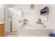 Bathroom featuring a soaking tub, glass enclosed shower, and tile flooring at 8808 Homestead Rd, Las Vegas, NV 89143