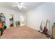 Bedroom with ceiling fan, carpet flooring, and walk-in closet at 8808 Homestead Rd, Las Vegas, NV 89143