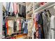 Walk-in closet with built-in shelving and ample hanging space for clothes and shoes at 8808 Homestead Rd, Las Vegas, NV 89143