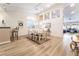Dining room with modern floors, wainscoting, contemporary lighting, and a large arched window at 8808 Homestead Rd, Las Vegas, NV 89143
