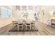 Formal dining room with modern floors, contemporary lighting, and pass through to the living room at 8808 Homestead Rd, Las Vegas, NV 89143