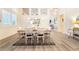 Formal dining room with modern floors, contemporary lighting, and pass through to the living room at 8808 Homestead Rd, Las Vegas, NV 89143