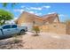 Single-story home with a gated side yard, two-car garage, desert landscaping, and room for RV parking at 8808 Homestead Rd, Las Vegas, NV 89143