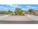 Charming single story home featuring a spacious driveway and gorgeous desert landscaping at 8808 Homestead Rd, Las Vegas, NV 89143