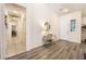 Inviting home entry featuring wood look floors and a view of the hall and door at 8808 Homestead Rd, Las Vegas, NV 89143