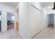 Bright hallway featuring neutral tile flooring, closet, and doorways leading to other rooms in the home at 8808 Homestead Rd, Las Vegas, NV 89143