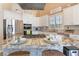 Gorgeous kitchen with granite countertops, stainless steel appliances, and a center island with barstool seating at 8808 Homestead Rd, Las Vegas, NV 89143