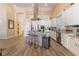 Modern kitchen featuring stainless steel appliances, an island with bar seating, and lots of natural light at 8808 Homestead Rd, Las Vegas, NV 89143