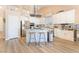Modern kitchen featuring stainless steel appliances, an island with bar seating, and lots of natural light at 8808 Homestead Rd, Las Vegas, NV 89143