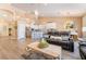 Bright living room with an open floor plan, comfortable seating, and a view into the modern kitchen at 8808 Homestead Rd, Las Vegas, NV 89143