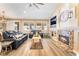Spacious living room with a fireplace, recessed lighting, and a view to other parts of this open floorplan home at 8808 Homestead Rd, Las Vegas, NV 89143