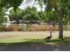 Peaceful pond view with a goose strolling on the grassy shore, complemented by a picturesque backdrop at 8808 Homestead Rd, Las Vegas, NV 89143