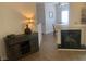 Inviting living room with a wooden cabinet, decorative lamp, and a cozy fireplace at 9000 Las Vegas Blvd # 1037, Las Vegas, NV 89123
