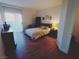 Spacious bedroom with a large bed, hardwood floors, and plenty of natural light at 9000 Las Vegas Blvd # 1037, Las Vegas, NV 89123