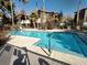 Community pool with lounge chairs and palm trees at 9000 Las Vegas Blvd # 1037, Las Vegas, NV 89123