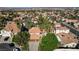 Expansive aerial view highlighting the property's manicured lawn, mature trees, and desirable location at 902 Cripple Creek Ct, Henderson, NV 89014