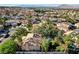 Scenic aerial view capturing the property, pool, and surrounding cityscape at 902 Cripple Creek Ct, Henderson, NV 89014