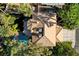 Aerial view showcases a beautiful roof, swimming pool, trees, and manicured backyard at 902 Cripple Creek Ct, Henderson, NV 89014