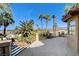 Balcony with palm tree views, wrought iron railing, and tile flooring at 902 Cripple Creek Ct, Henderson, NV 89014